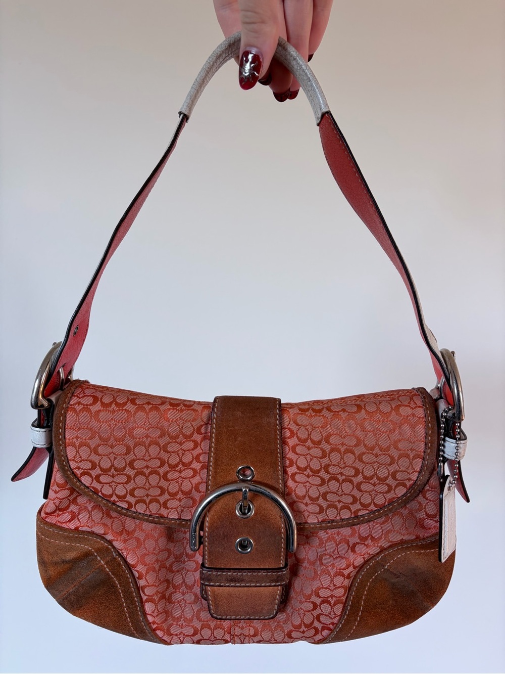 RARE Coach vintage SOHO flap shoulder purse with orange and white details.